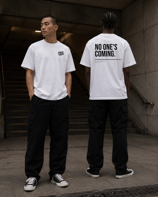 No One's Coming — Tee · White — Lifestyle — AI-generated visual
