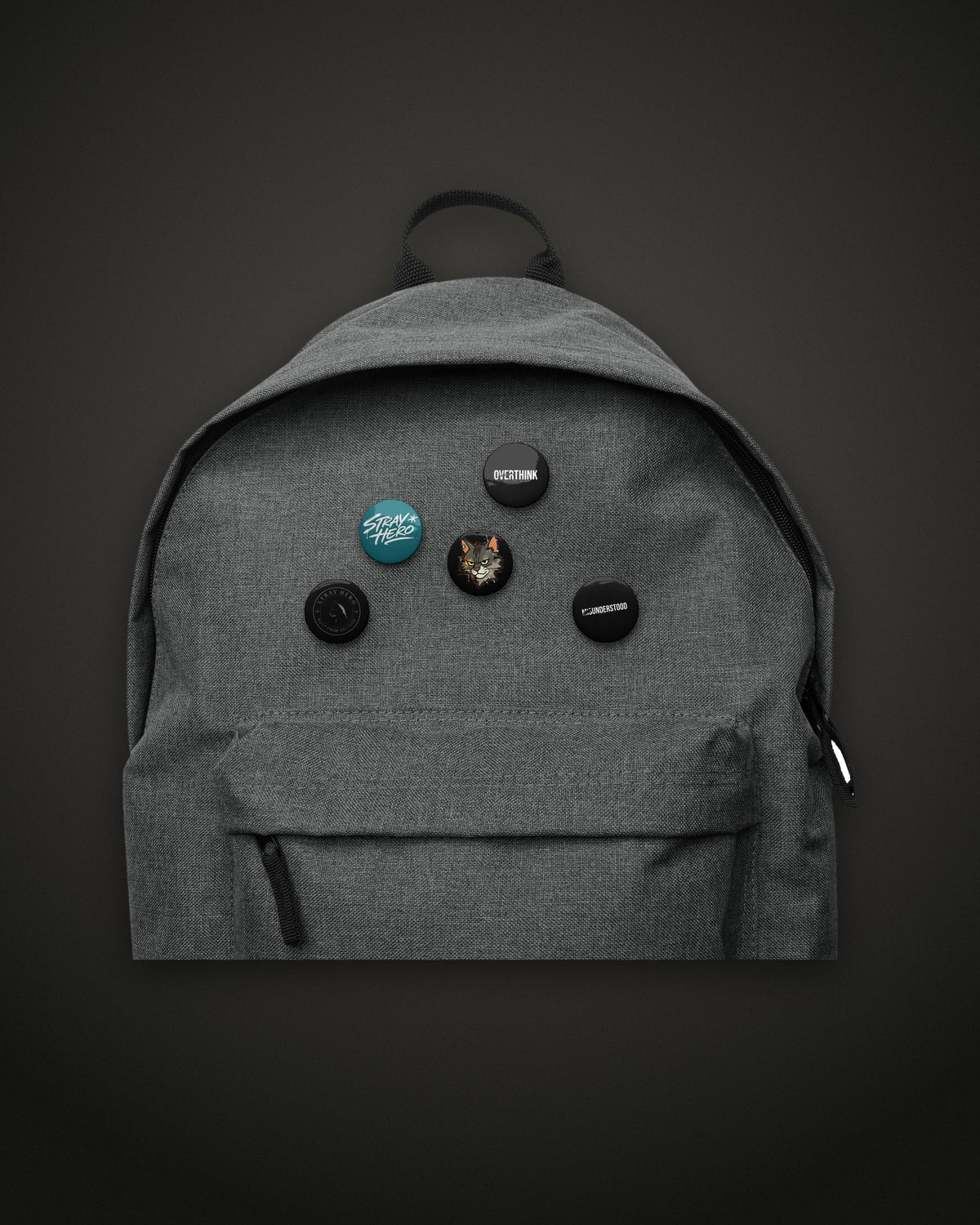 Pin Set, 1.25 inch buttons on a grey backpack