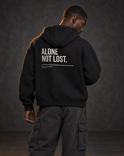 Alone Not Lost Zip Hoodie, worn, back print, black — AI-generated visual