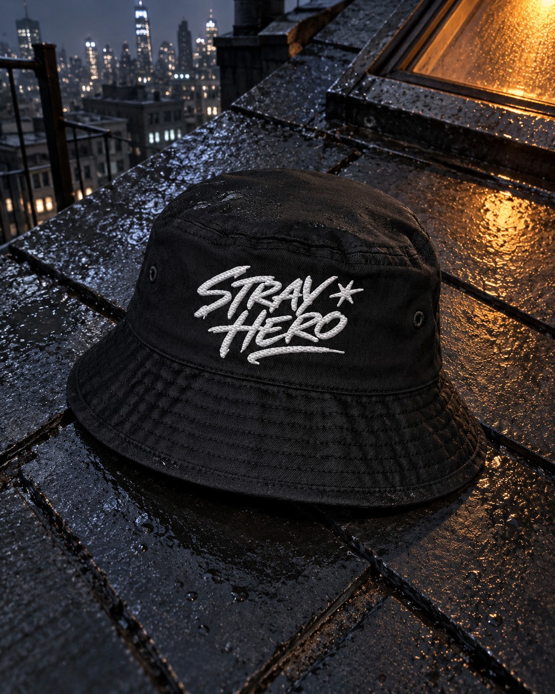 Signature Bucket Hat, front embroidery, black, on wet rooftop tiles beside a lit skylight at night — AI-generated visual