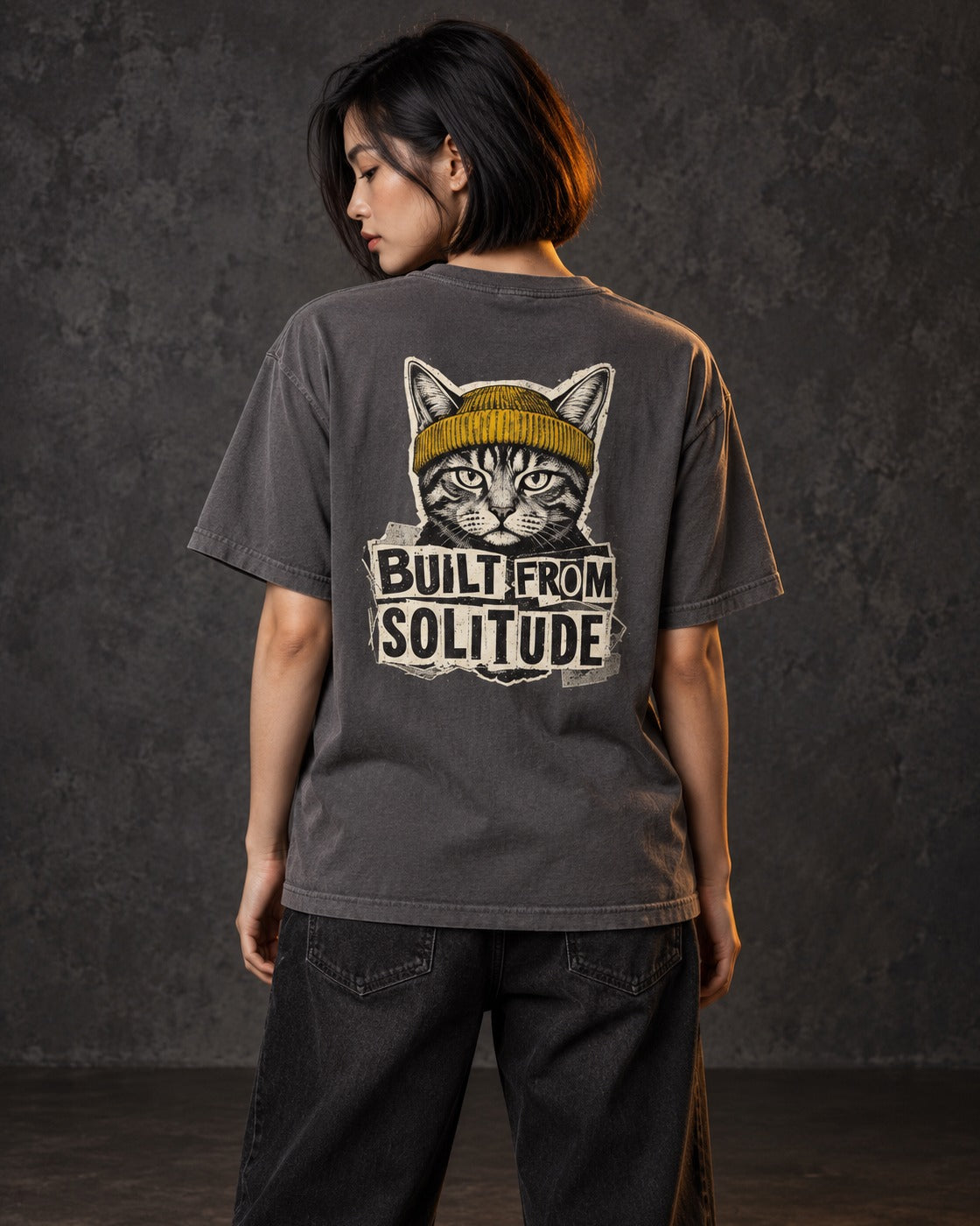 Built From Solitude Graffiti Tee, worn, back print, graphite — AI-generated visual