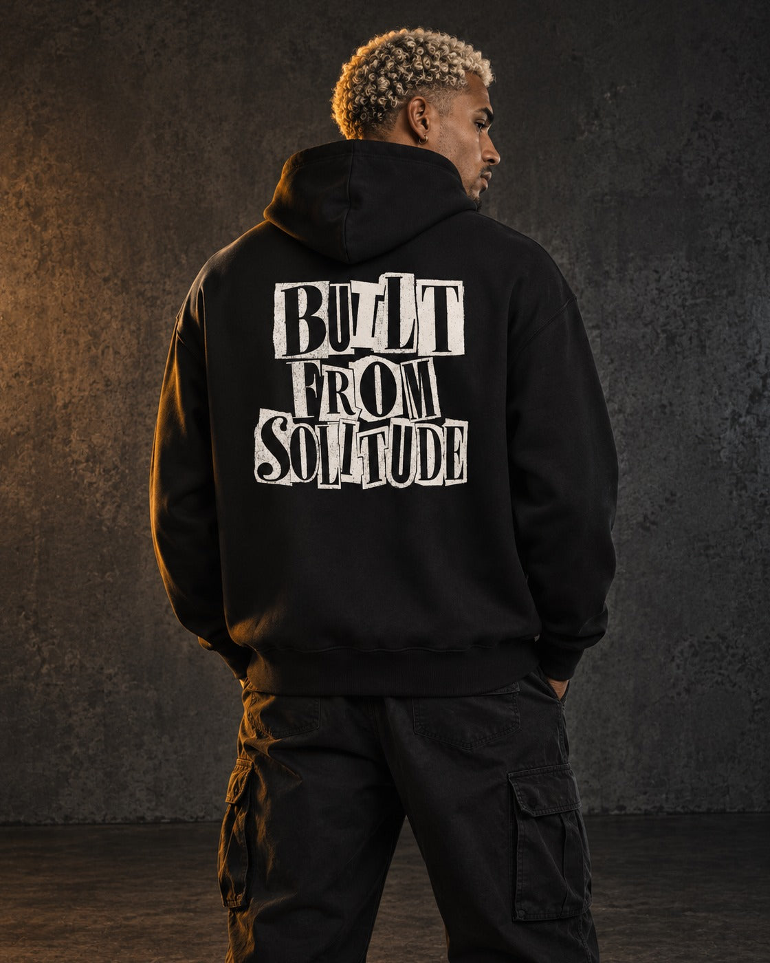 Built From Solitude Hoodie Paste-Up, worn, back print, black — AI-generated visual