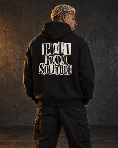 Built From Solitude Hoodie Paste-Up, worn, back print, black — AI-generated visual