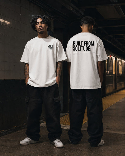 Built From Solitude — Tee · White — Lifestyle — AI-generated visual