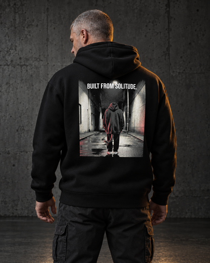 Built From Solitude Hoodie, worn, back print, black — AI-generated visual