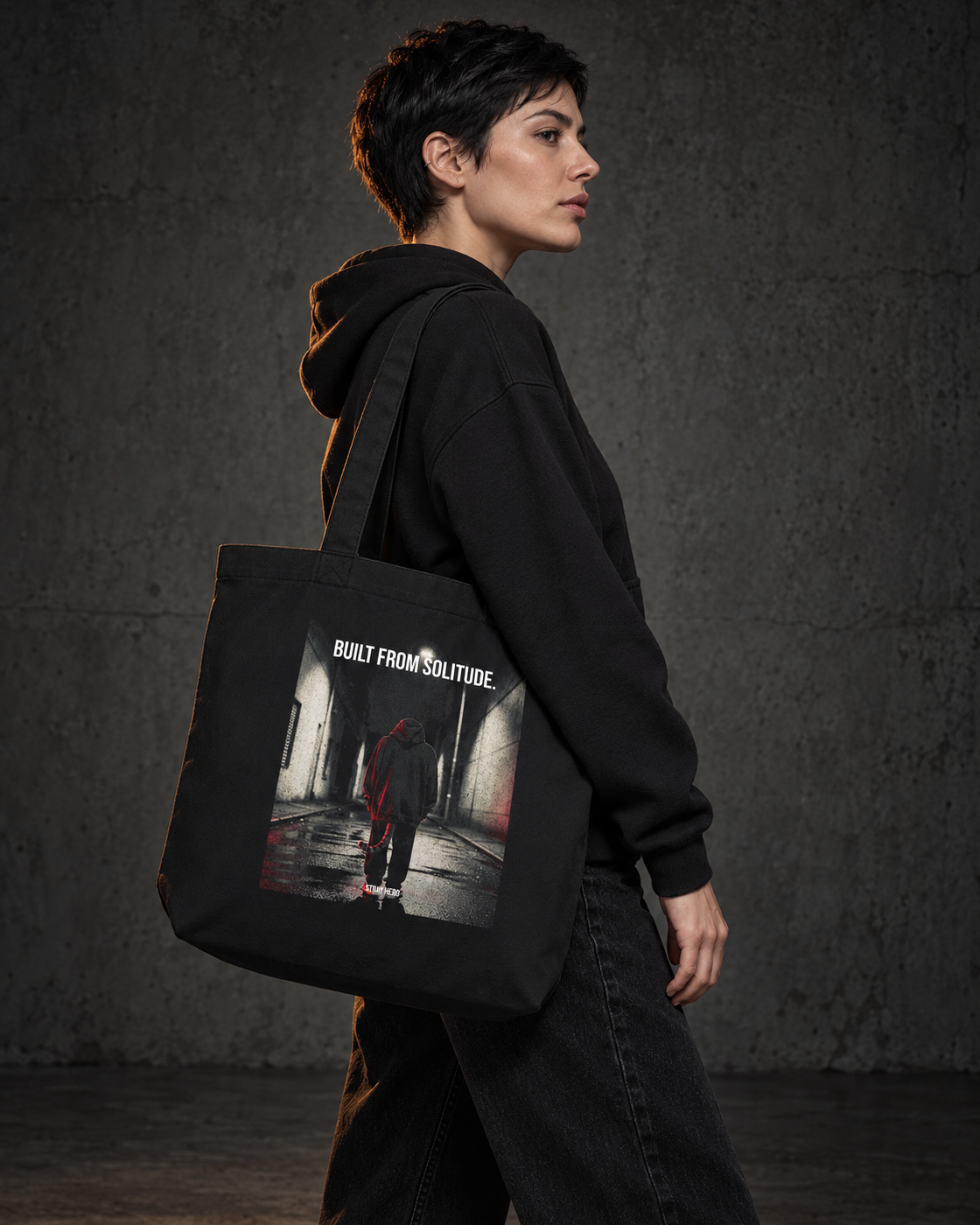 Built From Solitude Organic Tote, carried, back print, black — AI-generated visual