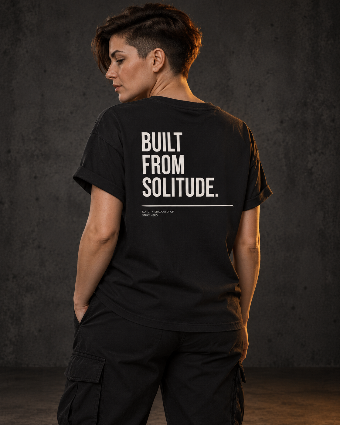 Built From Solitude Women's Tee, worn, back print, black — AI-generated visual
