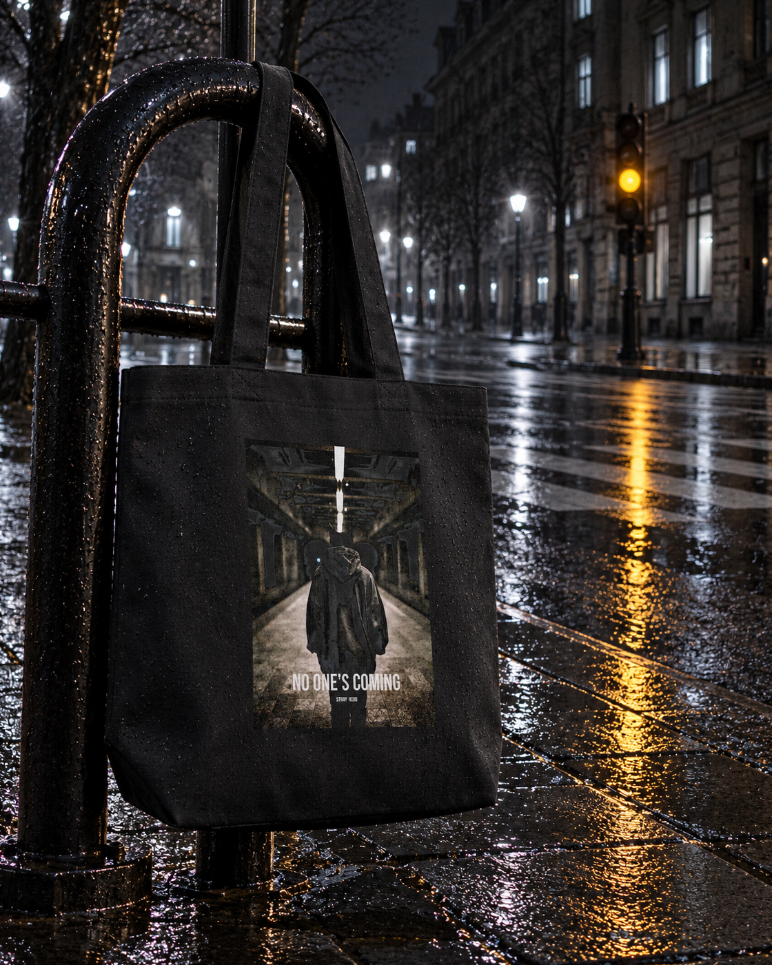 No One's Coming Organic Tote, back print, black, hanging on a bike rack on a rainy street — AI-generated visual