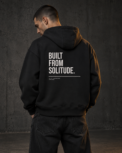 Built From Solitude Zip Hoodie, worn, back print, black — AI-generated visual