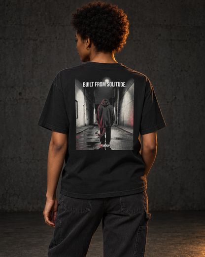 Built From Solitude Tee Cinematic, worn, back print, black — AI-generated visual