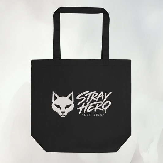 Schwarze Bio-Baumwoll-Tote mit Stray-Hero-Katzenlogo und Wortmarke