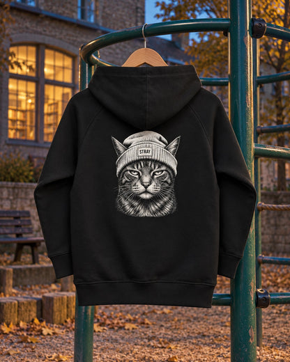 Ghost Kids Hoodie, back print, black, hanging on a playground climbing frame at dusk — AI-generated visual
