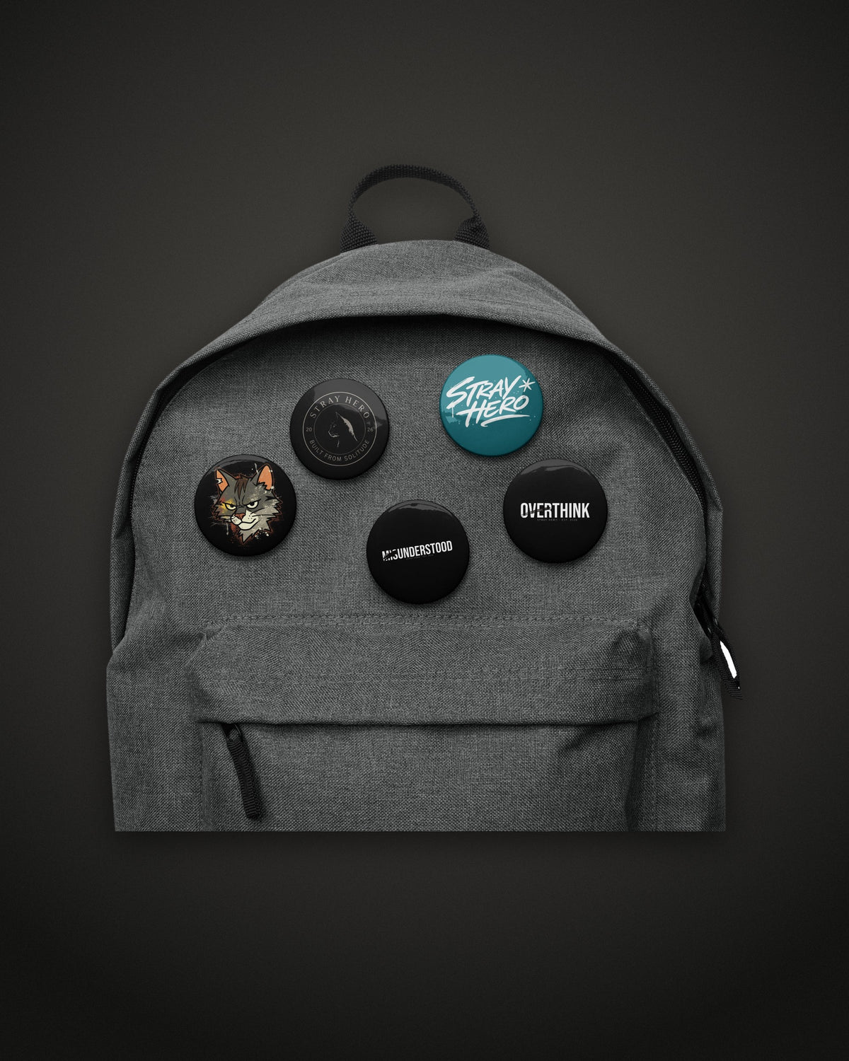 Pin Set, 2.25 inch buttons on a grey backpack