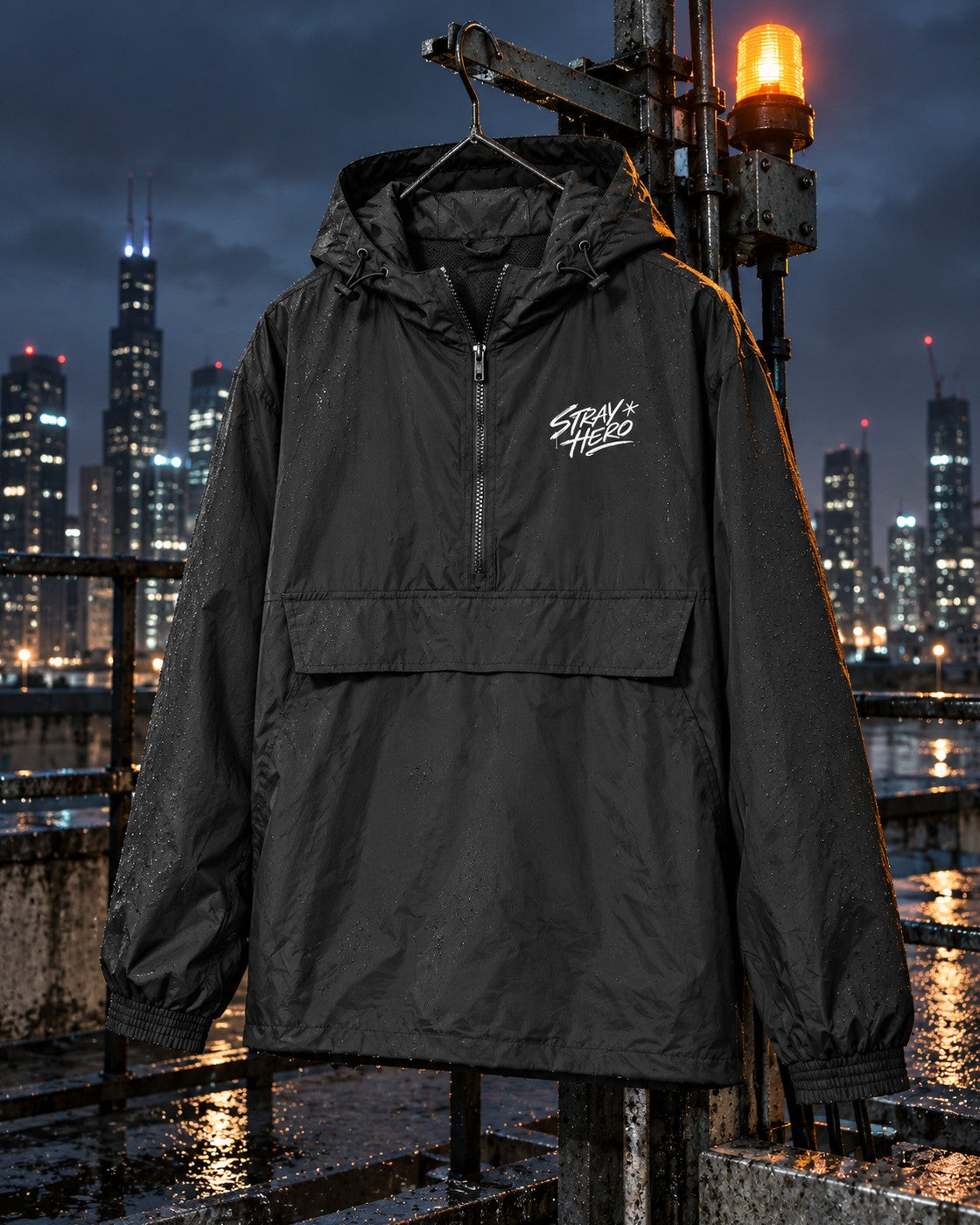 Script Windbreaker, chest print, black, hanging from a rooftop rail under an amber beacon at night — AI-generated visual
