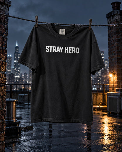 Monogram Tee, front print, black, pegged to a clothesline on a wet rooftop at night — AI-generated visual