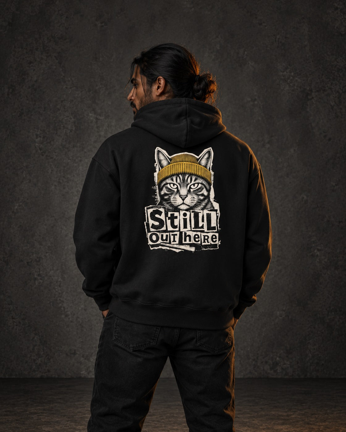 Still Out Here Hoodie, worn, back print, black — AI-generated visual