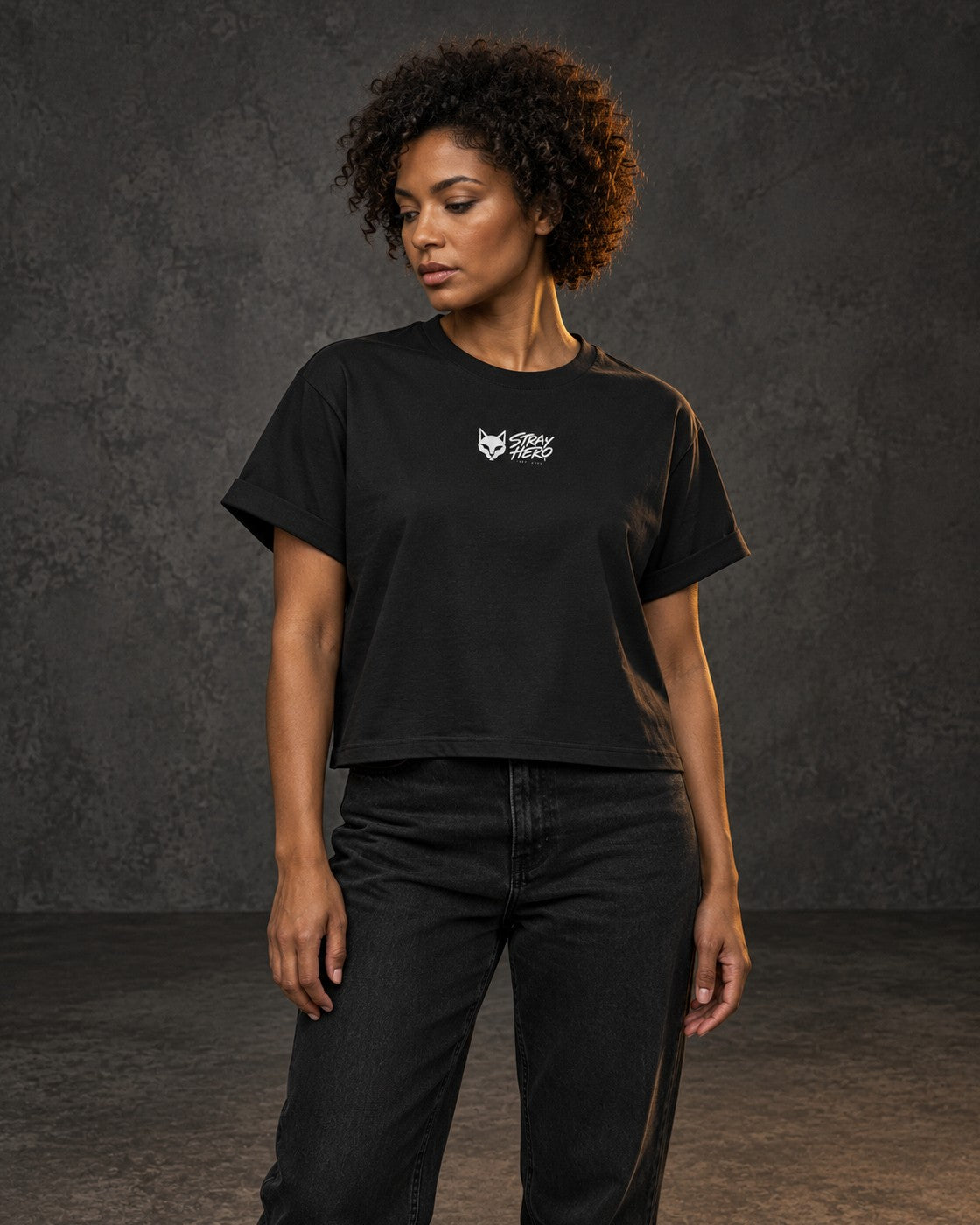 Stray Logo Women's Tee, worn, chest print, black — AI-generated visual