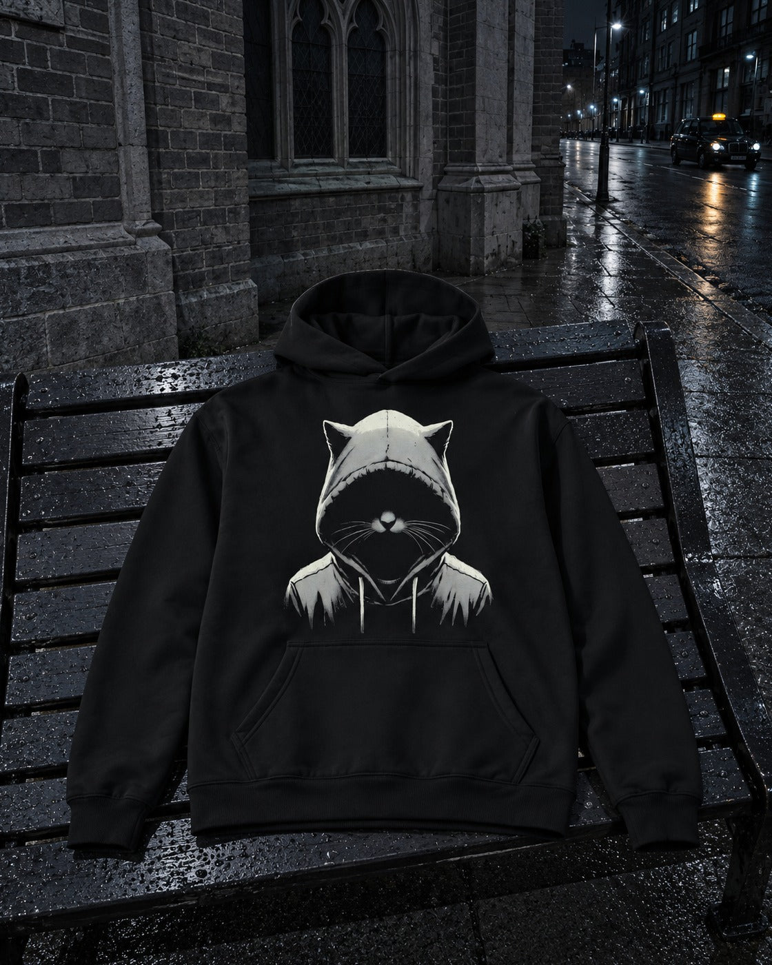 Out of the Dark Hoodie, front print, black, laid on a wet bench on a city street at night — AI-generated visual