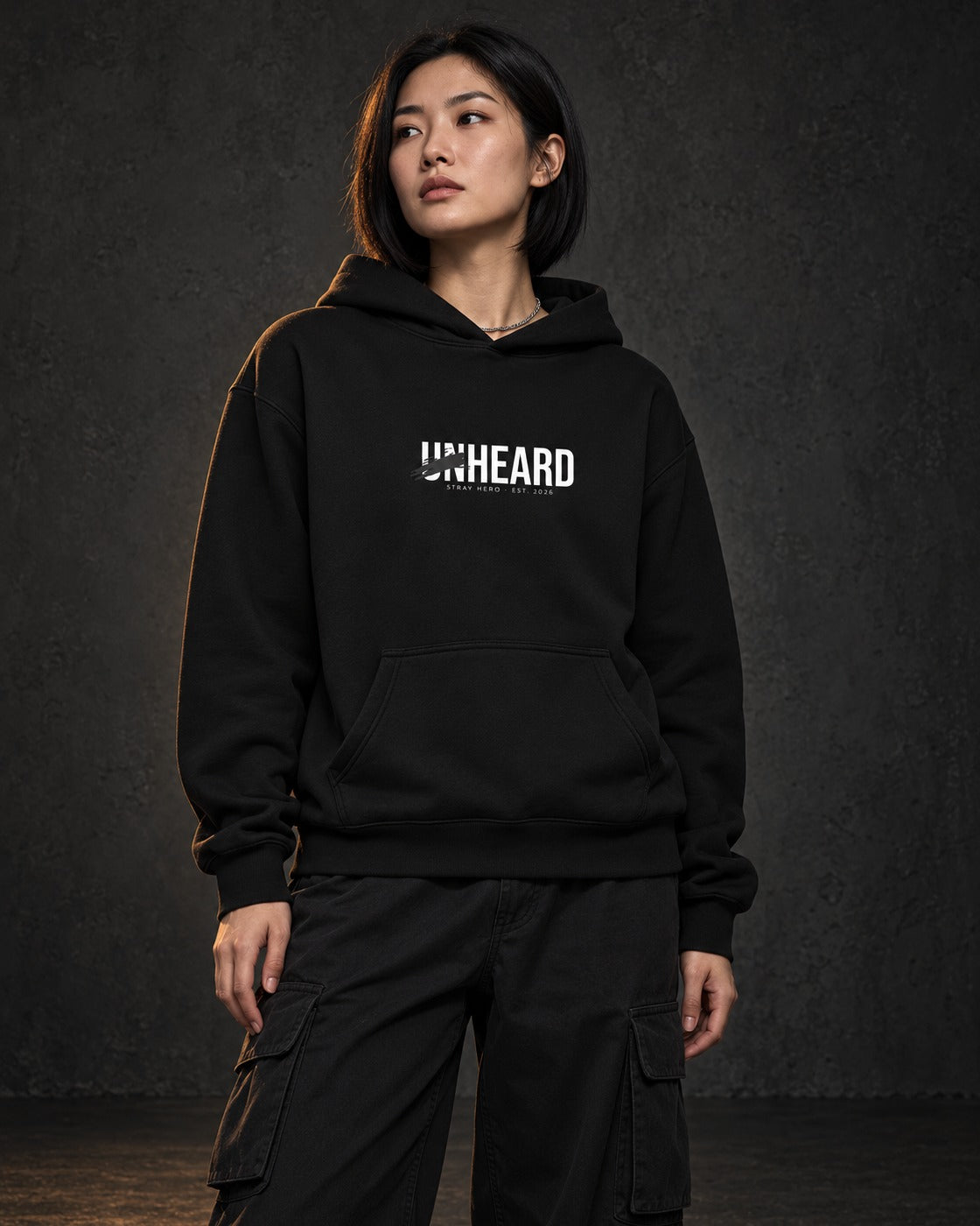 Unheard Hoodie, worn, front print, black — AI-generated visual