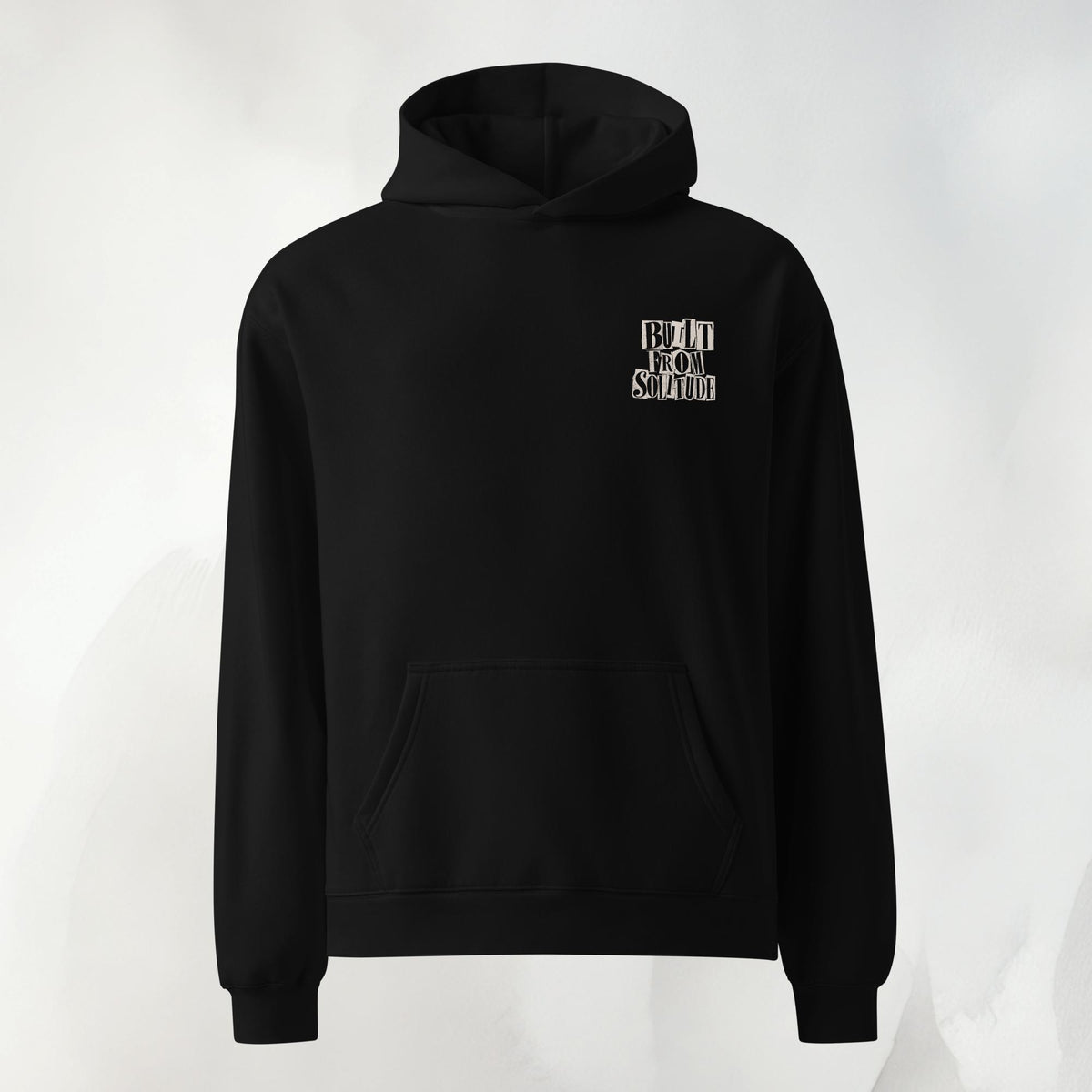 Front of the Built From Solitude paste-up hoodie in black, no front graphic