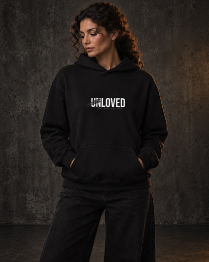 Unloved Hoodie, worn, front print, black — AI-generated visual